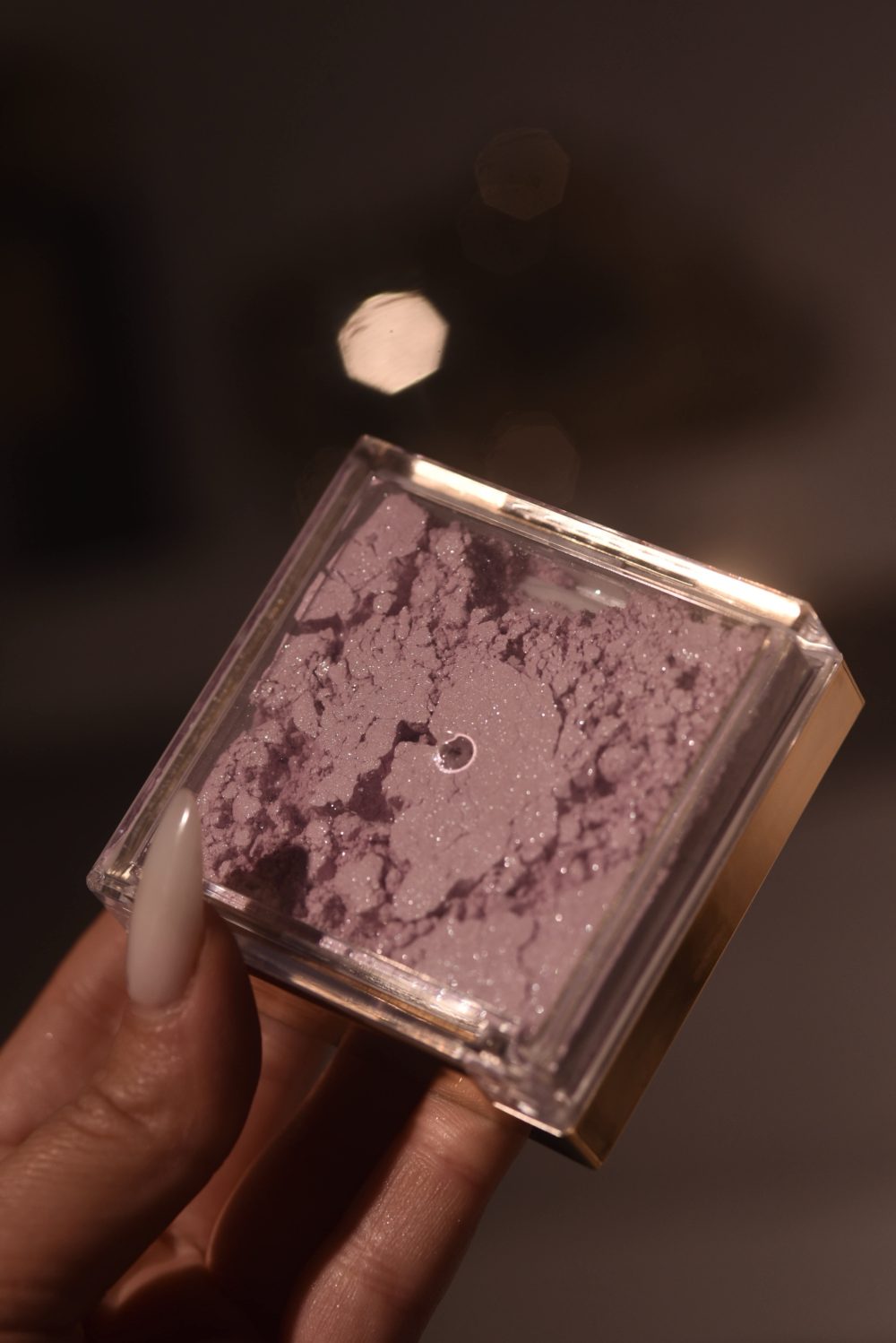 Baby pink  translucent glittery setting powder     Handbag-size powder.